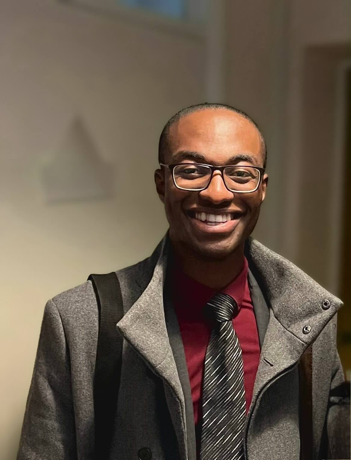 Seth Duku Smiling in a suit
